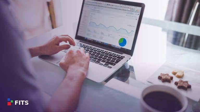 Person working on a laptop showing a business dashboard