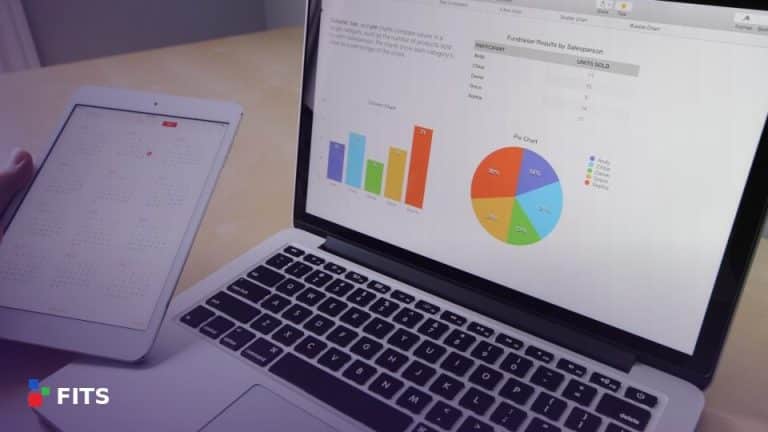 Laptop and tablet displaying business charts