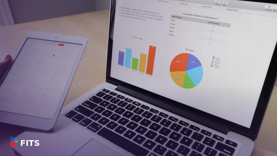 Laptop and tablet displaying business charts