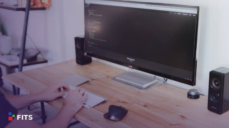 Desk with a computer monitor and keyboard