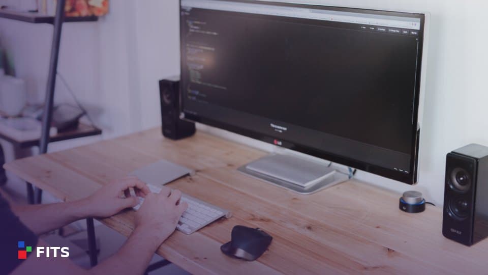 Desk with a computer monitor and keyboard