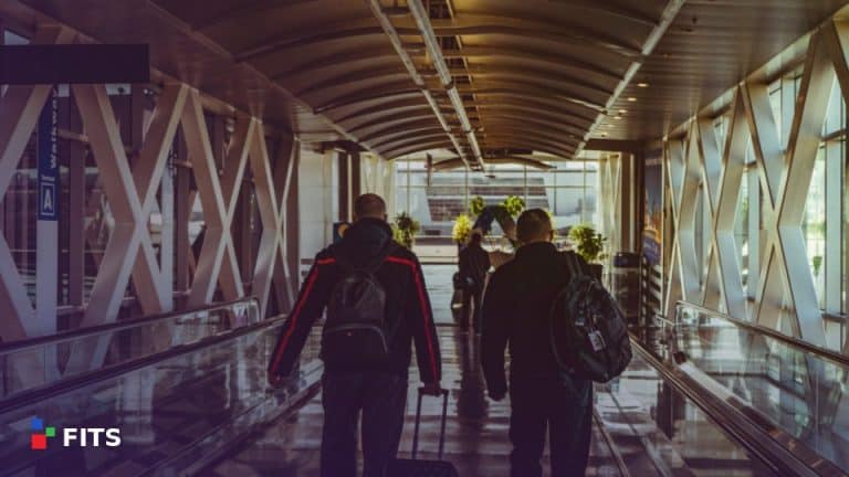 Business travellers walking through an airport walkway