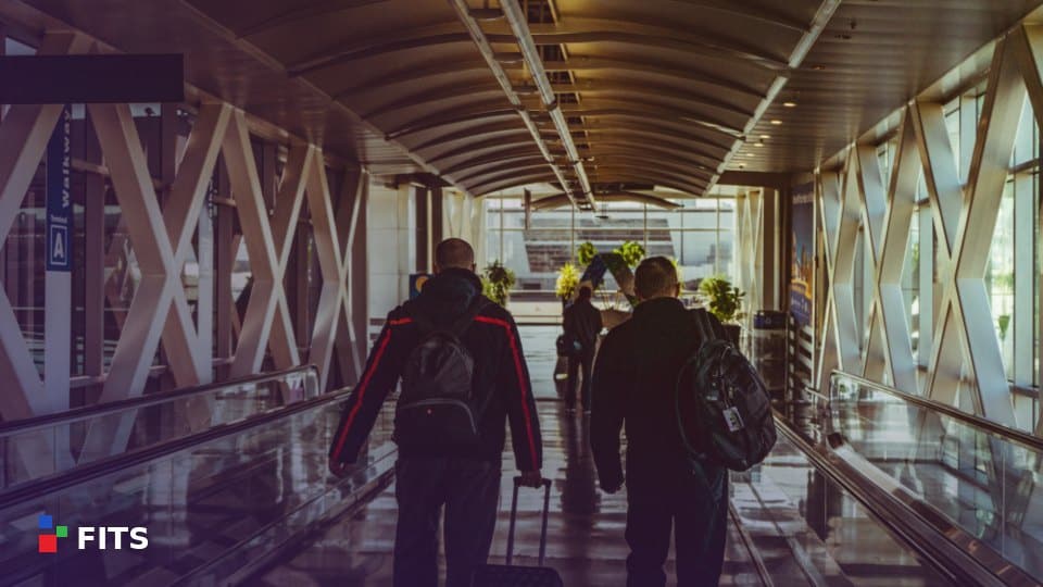 Business travellers walking through an airport walkway